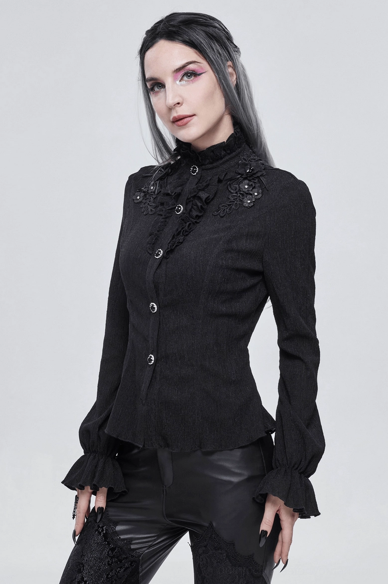 Full length side profile of black gothic stand collar blouse worn on model, showing silhouette and sleeve length