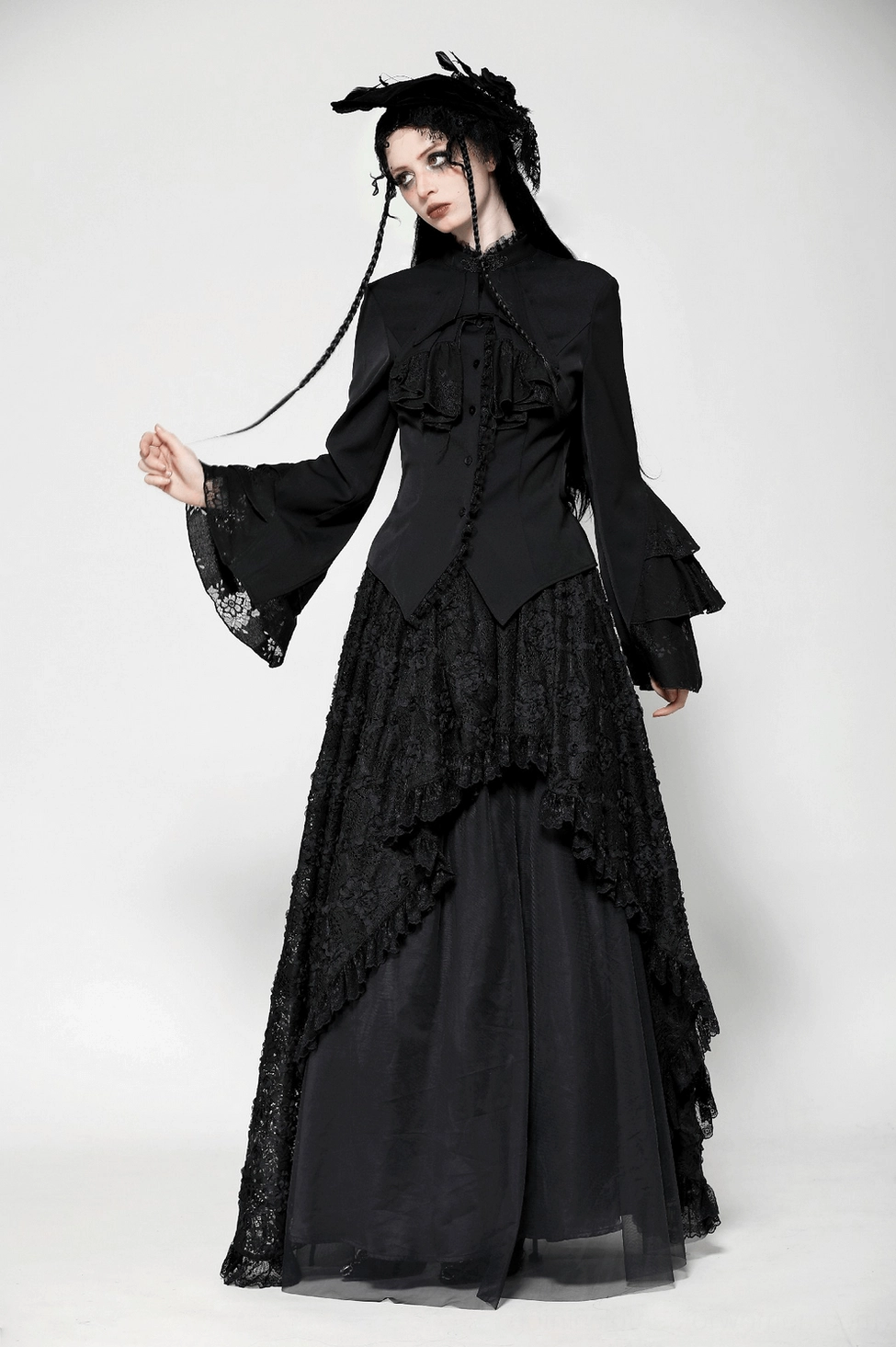 Black gothic Victorian blouse side profile view showing fitted waist, ruffle sleeves, and overall silhouette proportions on model