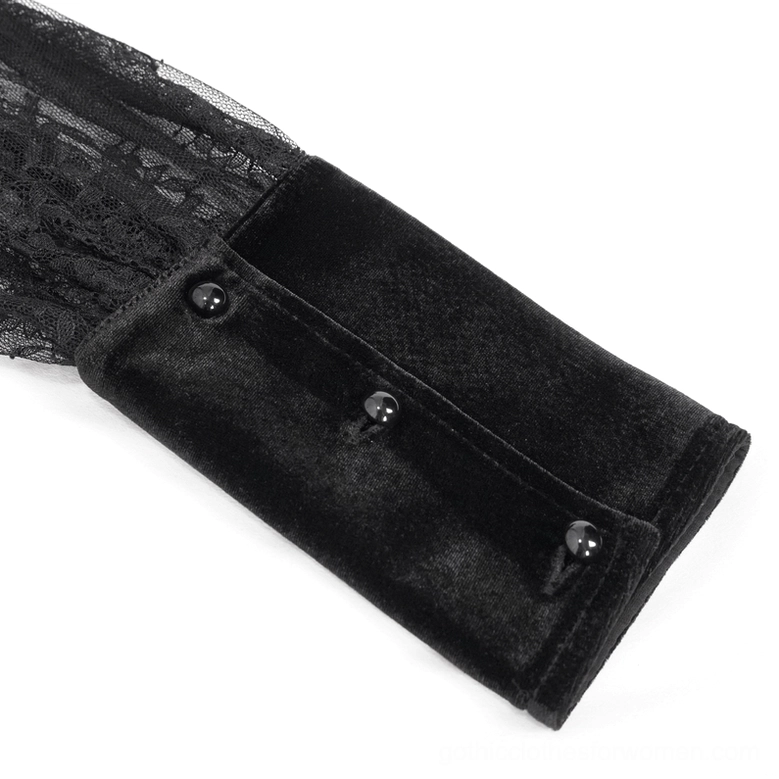 Close-up of black gothic blouse wrist cuff showing velvet material three decorative buttons and lace sleeve overlay