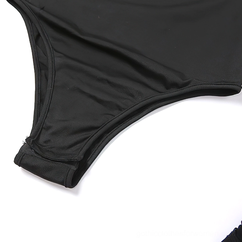 High-cut leg opening detail of black gothic bodysuit showing neat stitching and stretch fabric