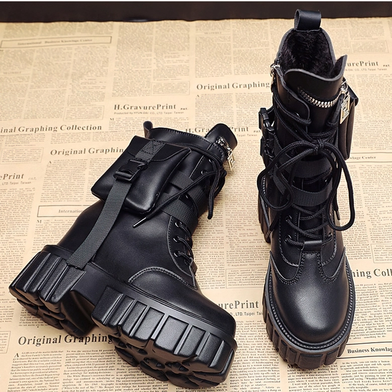 Black platform combat boots showing lug sole, lace-up system, and furry inner lining detail on newspaper background