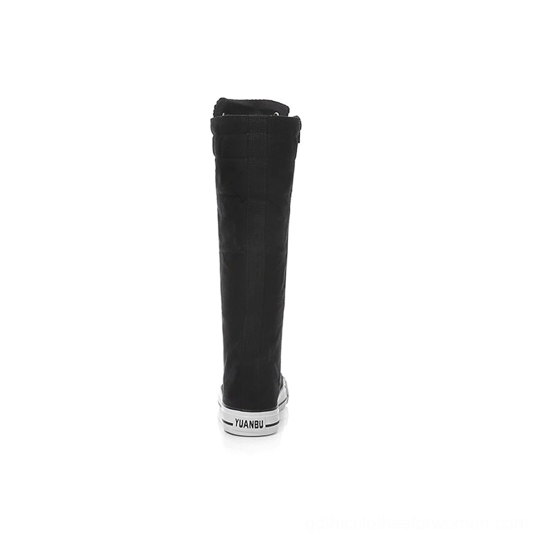 Single black canvas knee-high boot rear three-quarter view showing zipper and outsole branding