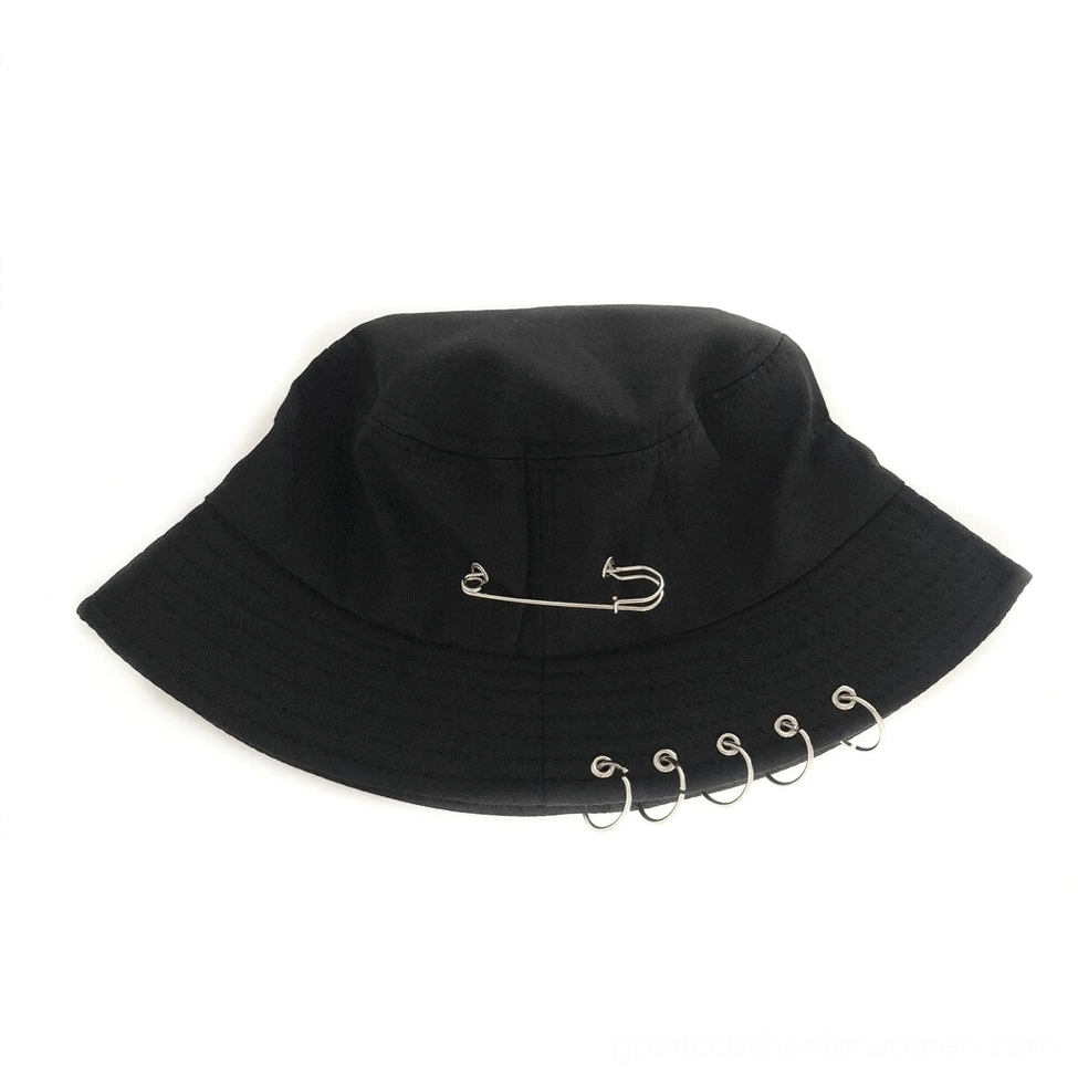Black gothic bucket hat side profile showing metal ring trim on brim and safety pin crown decoration