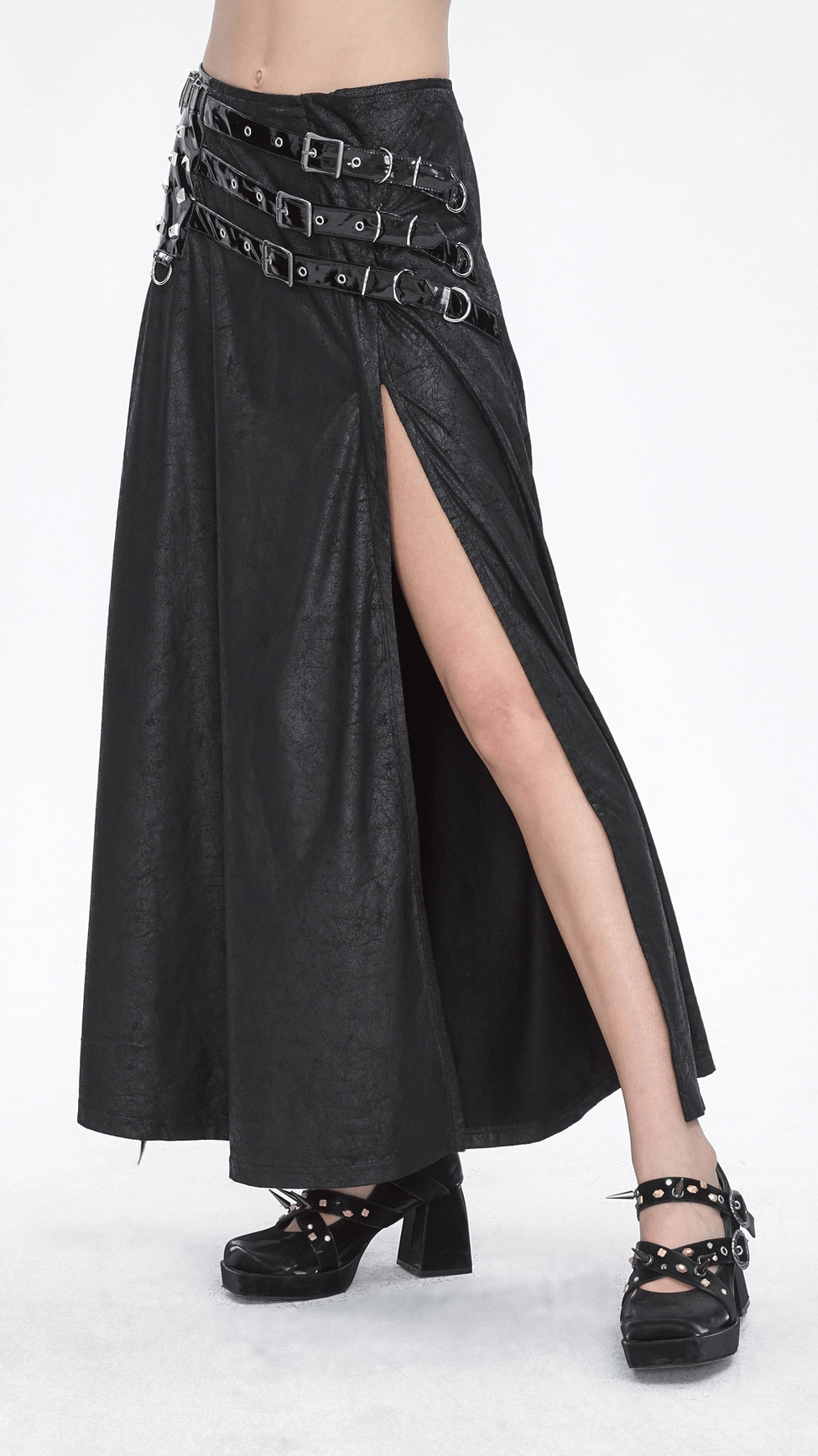 Black gothic buckled long skirt showcasing the dramatic floor-length cut with side slit and the eye-catching metal hardware that defines dark fashion