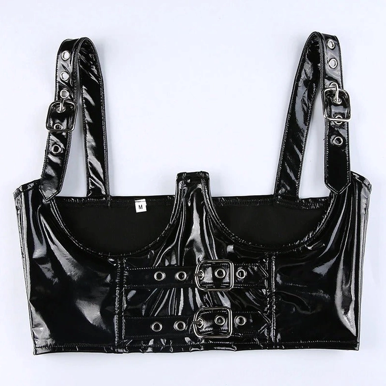 Top-down flat lay of black shiny PU leather gothic bustier crop top with adjustable shoulder straps and size tag visible