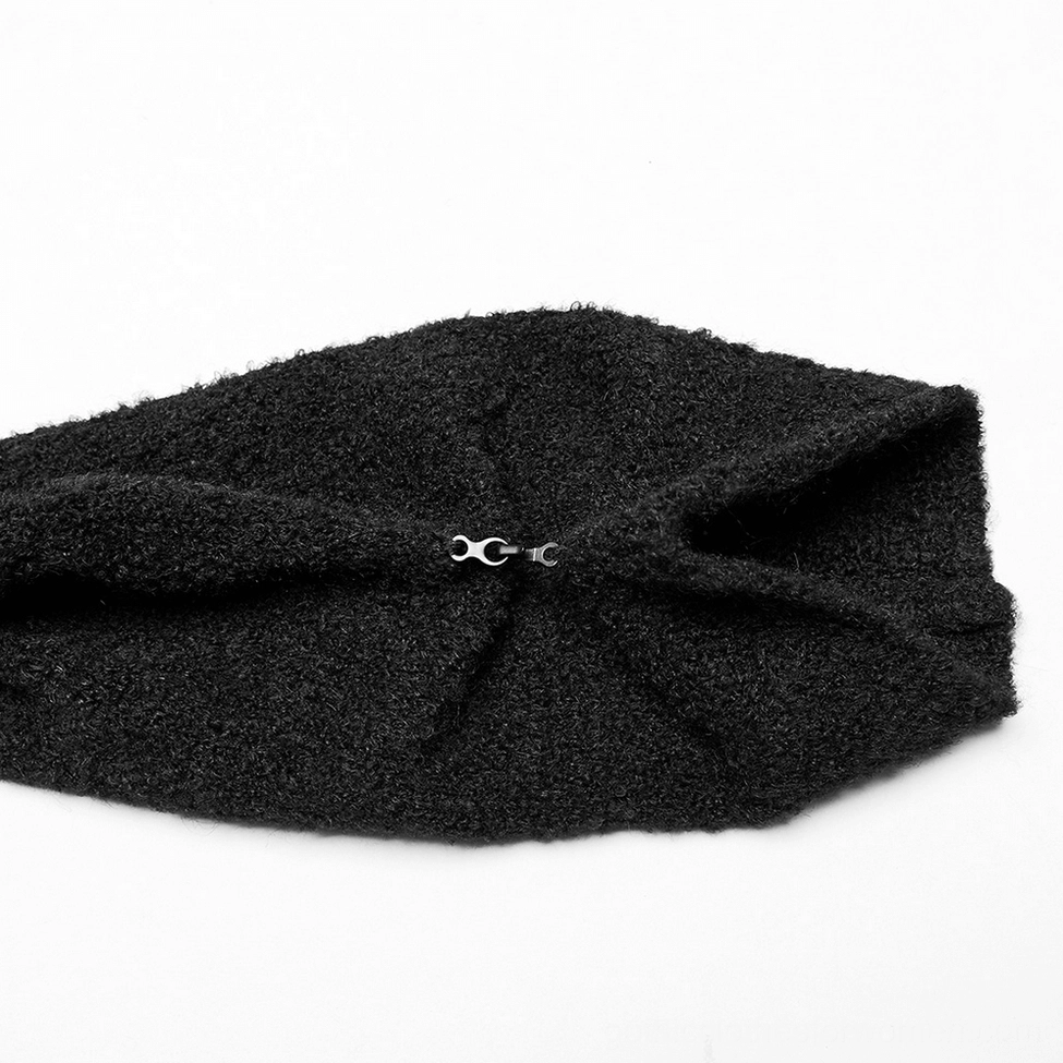 Close-up of black boucle wool-blend fabric with rolled cuff metal hook-and-eye closure detail