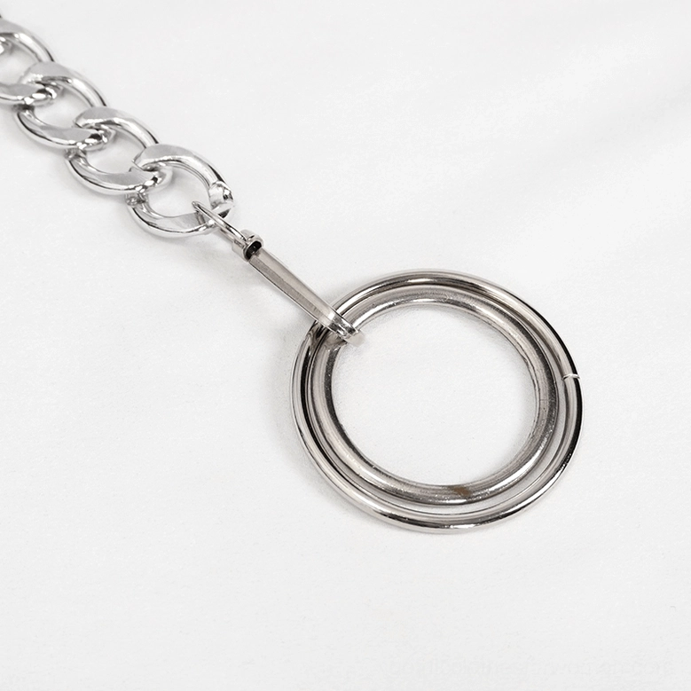 Close-up detail of metal chain waist and ring pendant on black gothic cargo pants