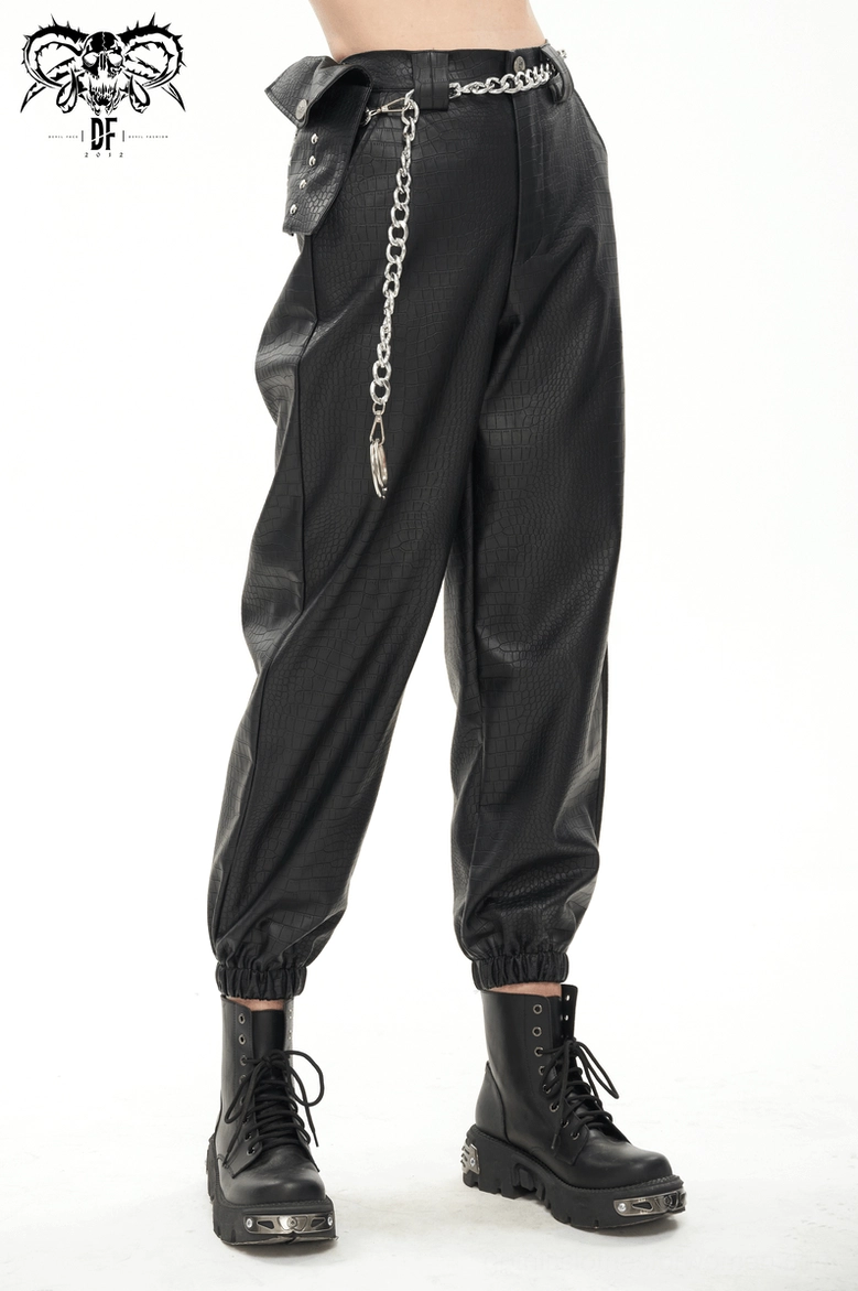Black gothic cargo pants styling detail showing chain integration and crocodile PU leather finish