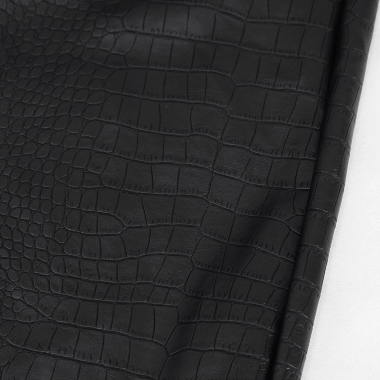 Black PU leather cargo pants waistband detail showing metal chain and ring pendant attachment