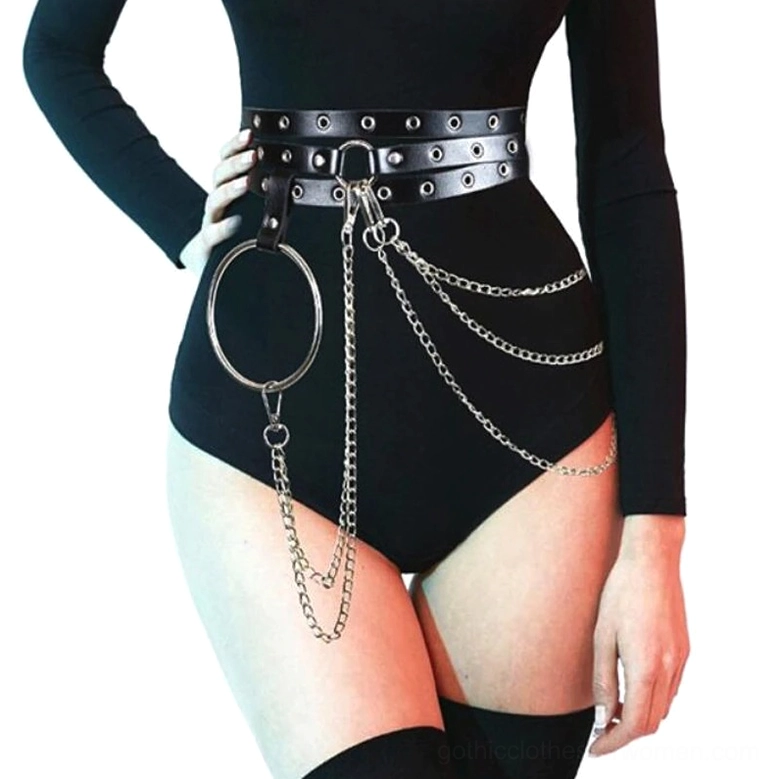 Black gothic chain waist belt worn by female model, front three-quarter view showcasing black faux leather straps with silver metal chains and large sculptural hoop against white studio background