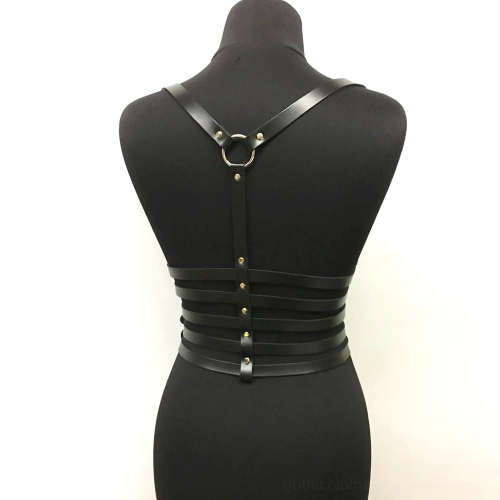 Black chest harness back view featuring Y-shaped O-ring connector and rivet-detailed straps, gothic body chain style