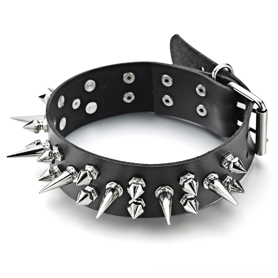 Adjustable black leather choker with spike and stud embellishments, flat lay top-down view showing metal buckle closure and texture details