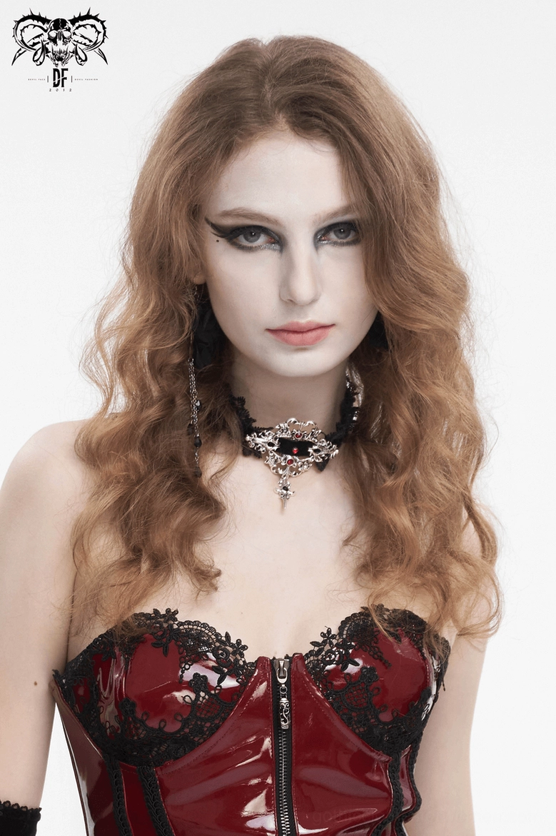 Gothic lace choker necklace with silver cross pendant and ruby red rhinestones, product lifestyle shot showing alternative fashion aesthetic