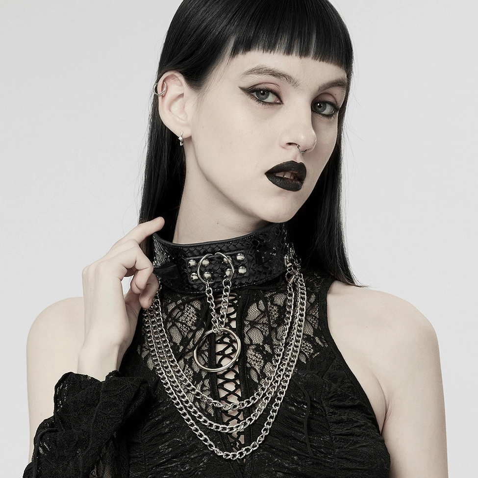 Close-up worn view of black gothic choker on model neck, hand positioned near collar, studio lighting