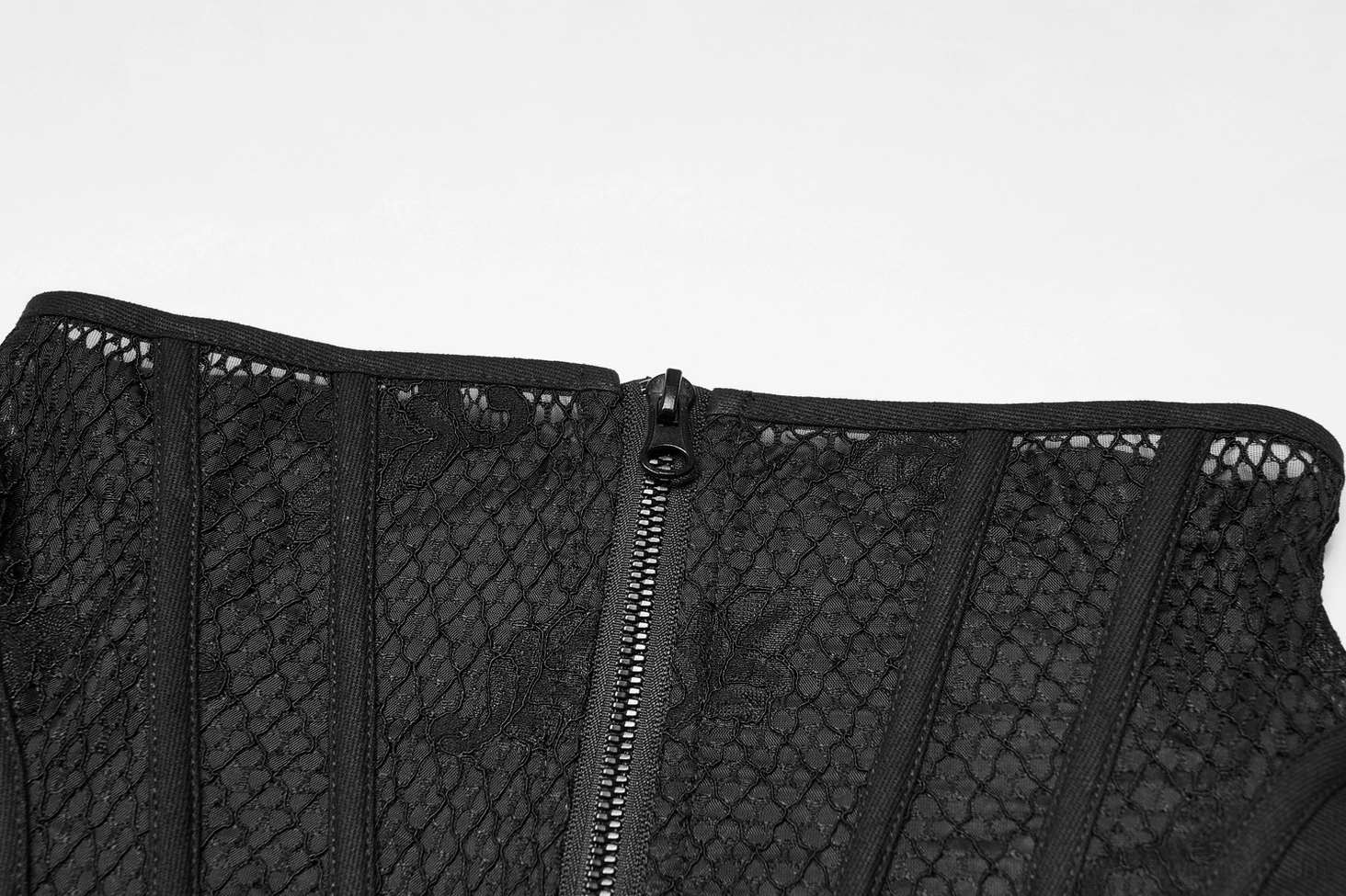 Detailed close-up of black gothic mesh cincher corset front zipper mechanism with embroidered mesh panels creating intricate floral patterns