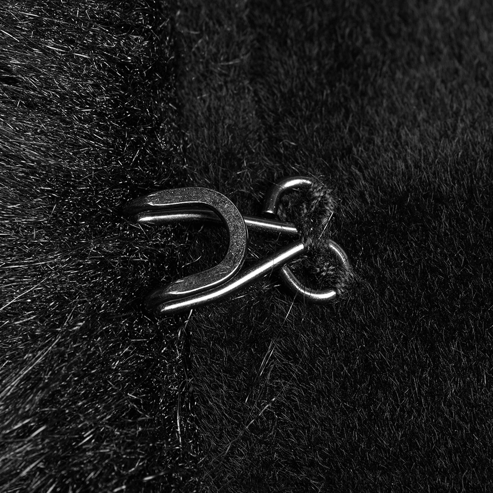 Detailed view of black gothic coat metal hook-and-eye fastener clasp on velvet fabric