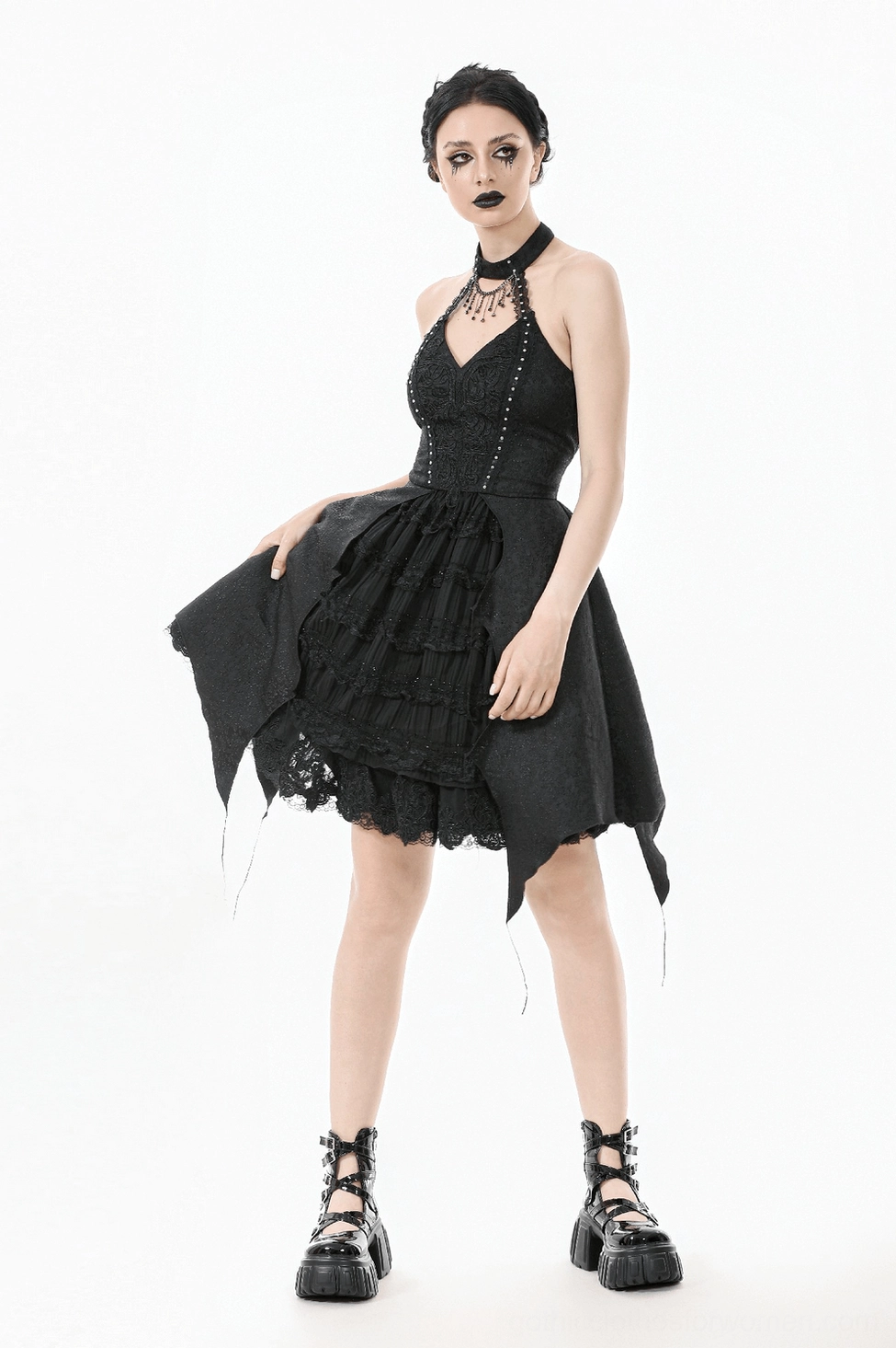 Black gothic corset dress showing adjustable lacing system and halter attachment mechanism