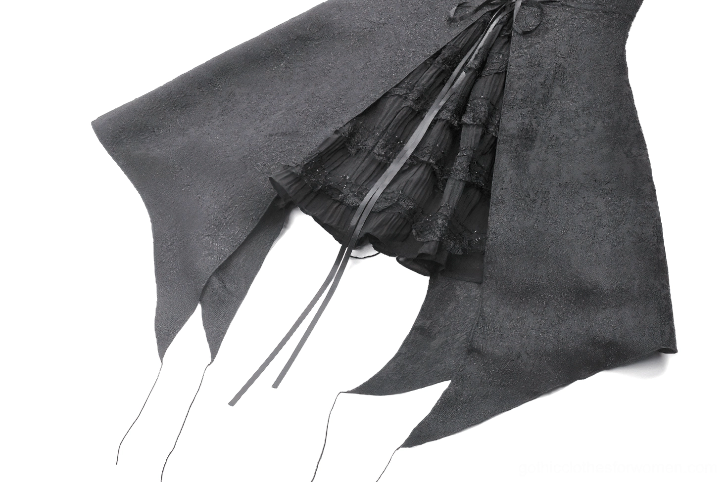 Close-up of asymmetrical ruffled hem on black gothic halter corset dress with inner layering