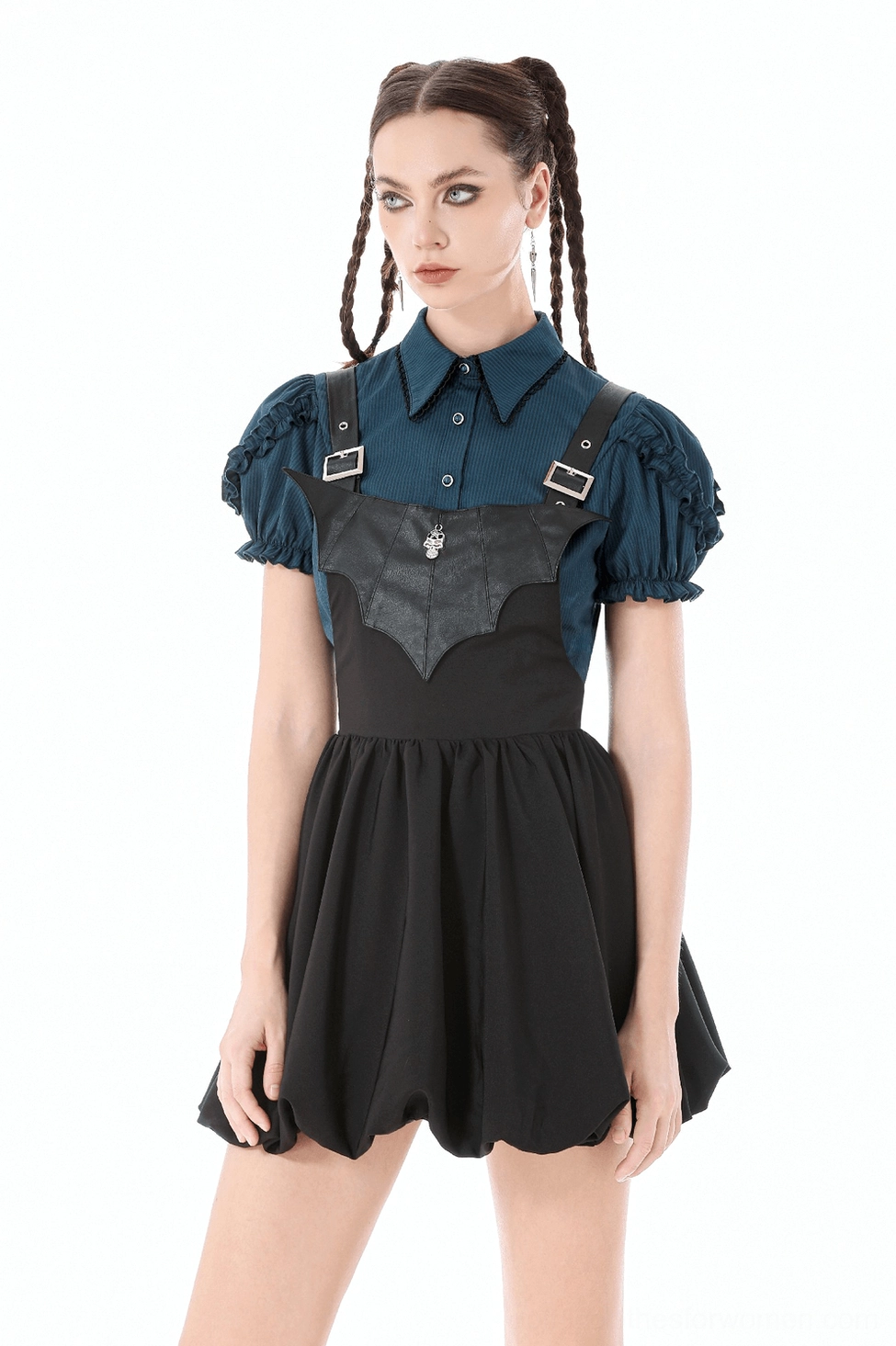 Full-body view of black gothic corset dress with heart skirt detail and metal hardware