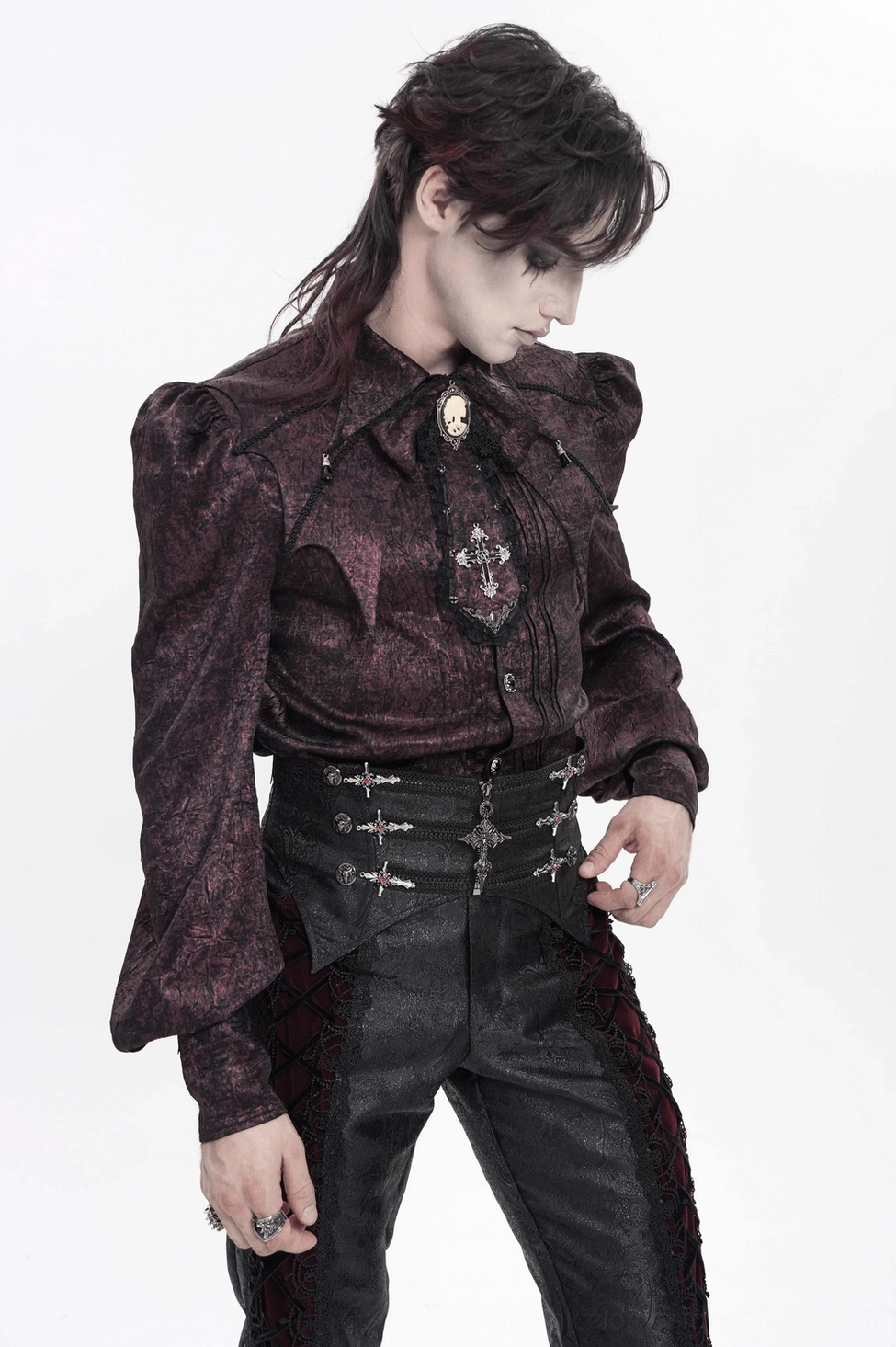 Detail view of black gothic corset belt showing embossed brocade pattern and pointed edges design