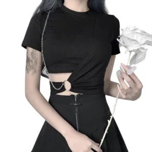 Black gothic crop top with chain cutout detail on model, front view showcasing twisted waist design and metal ring decoration