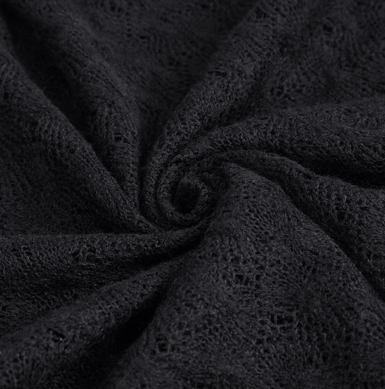 Black gothic quilted cropped top displaying half-zip collar and chain shoulder trims in detail shot