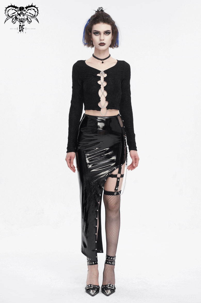 Gothic crop top on model featuring pentagram chain lace-up front, crop hem, and long fitted sleeves