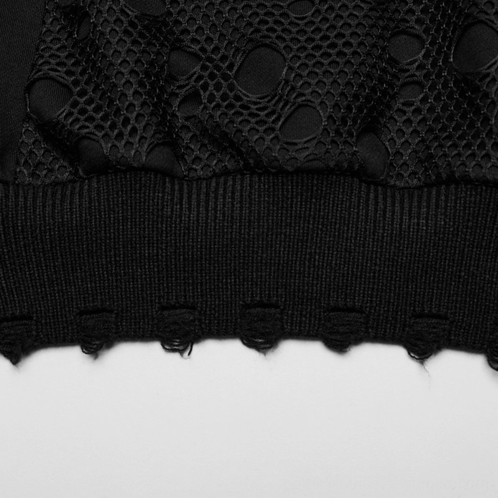 Close-up detail of black gothic hoodie hem showcasing distressed frayed finish and ribbed knit band