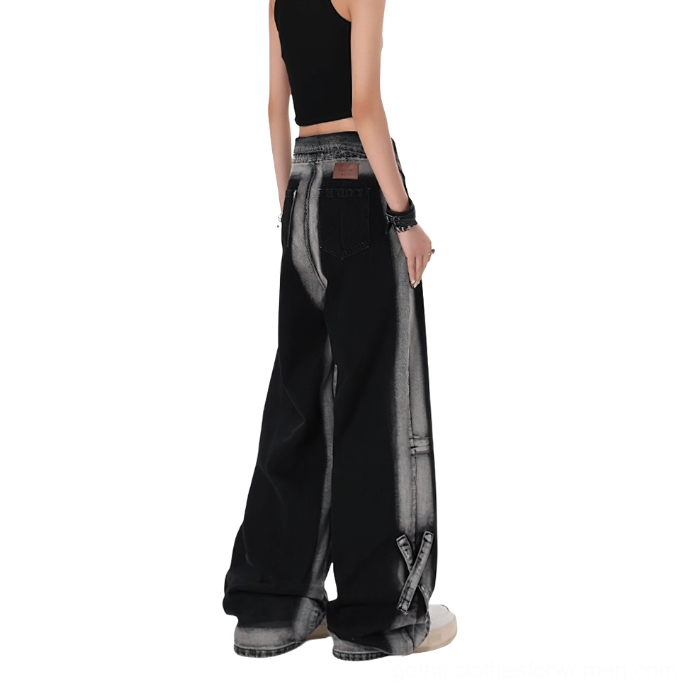 Back view of black gothic alternative denim jeans showing authentic leather patch, worn with black crop top