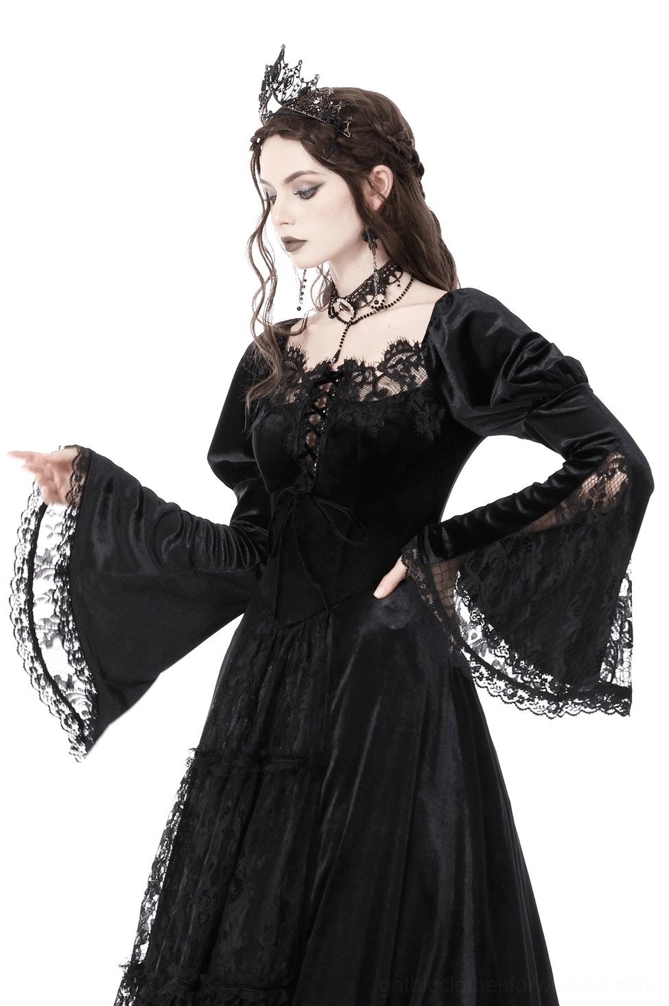 Details of black gothic gown showing square neckline, scalloped lace edges, and dramatic puff sleeve construction