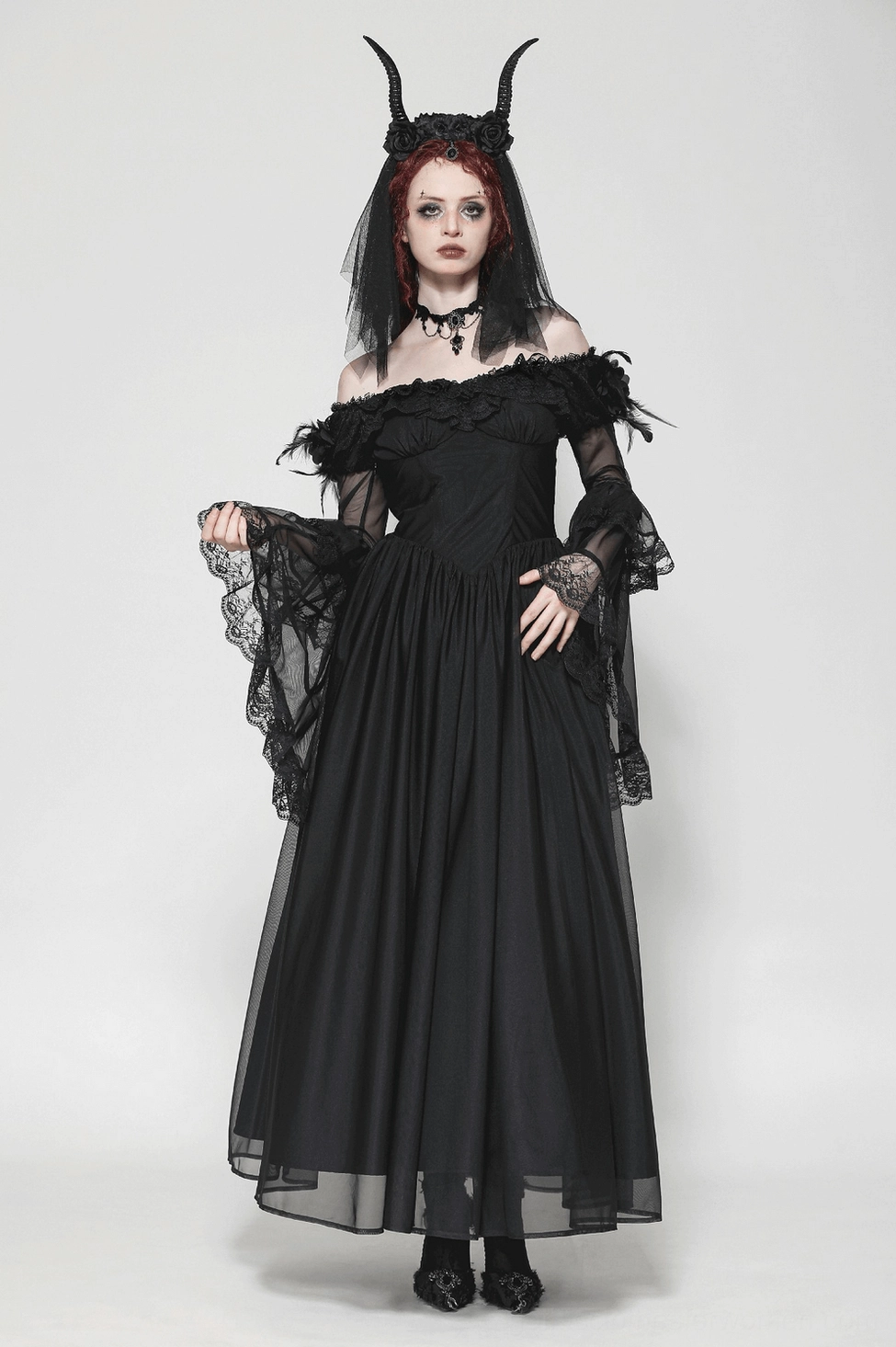 Black lace-up corset gothic dress back view highlighting crisscross lacing, ruffled trim, and romantic maxi silhouette