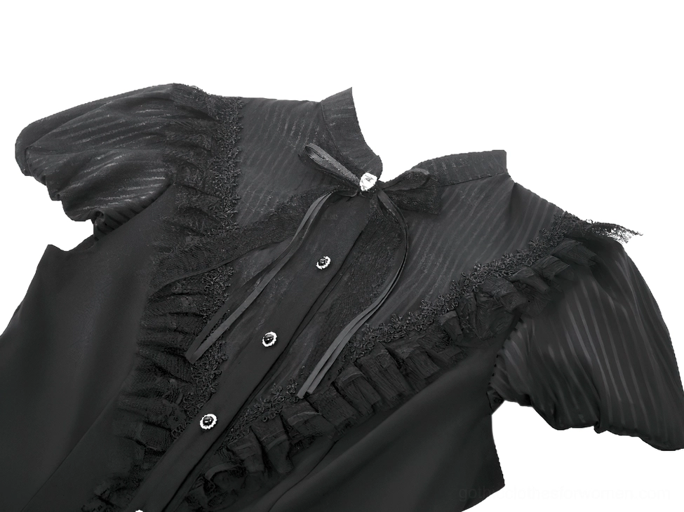 Close-up detail of black gothic dress collar featuring ruffled trim, decorative bow accent with gem embellishment, and striped fabric pattern on puff sleeves
