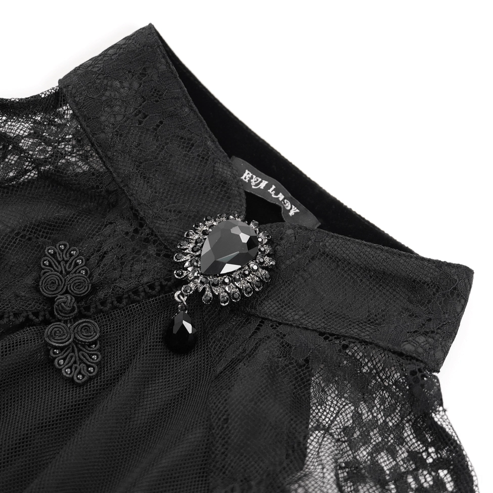 Close-up detail of black gothic dress mandarin collar with gemstone brooch and traditional Chinese frog fastener