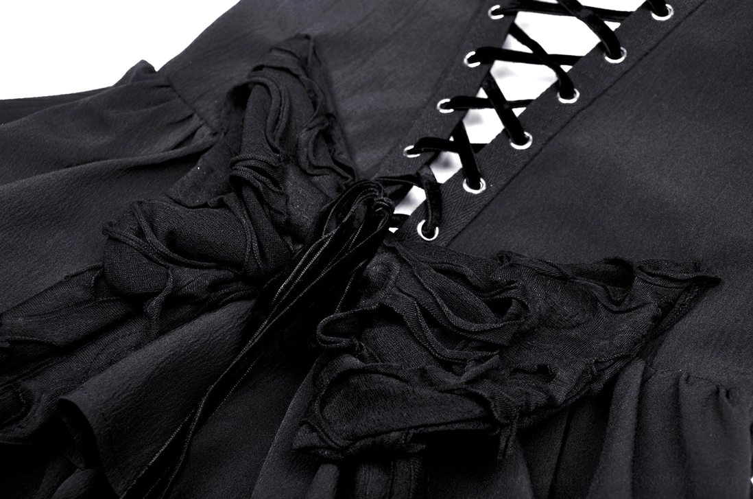 Close-up back detail of black gothic slip dress with lace-up corset design and ruffled fabric accents