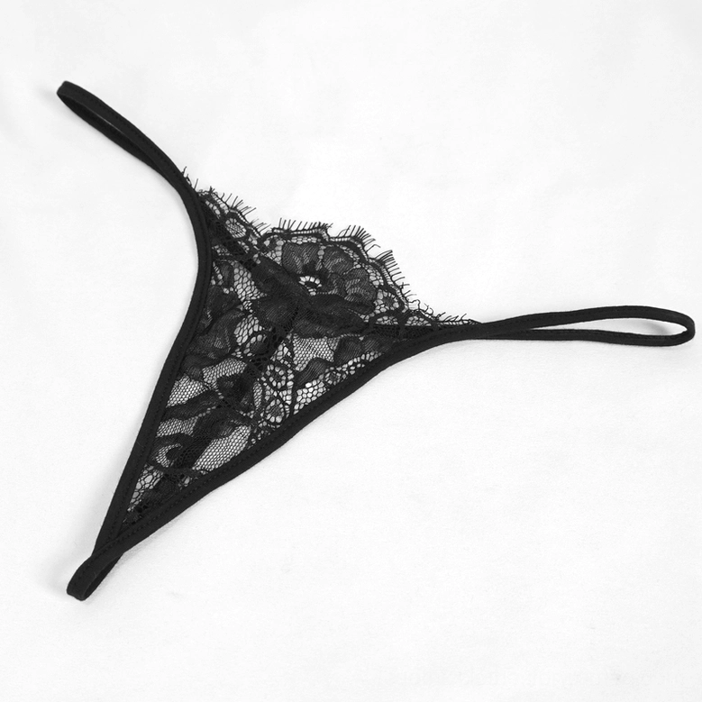 Black lace gothic dress crisscross bodice detail close-up on mannequin