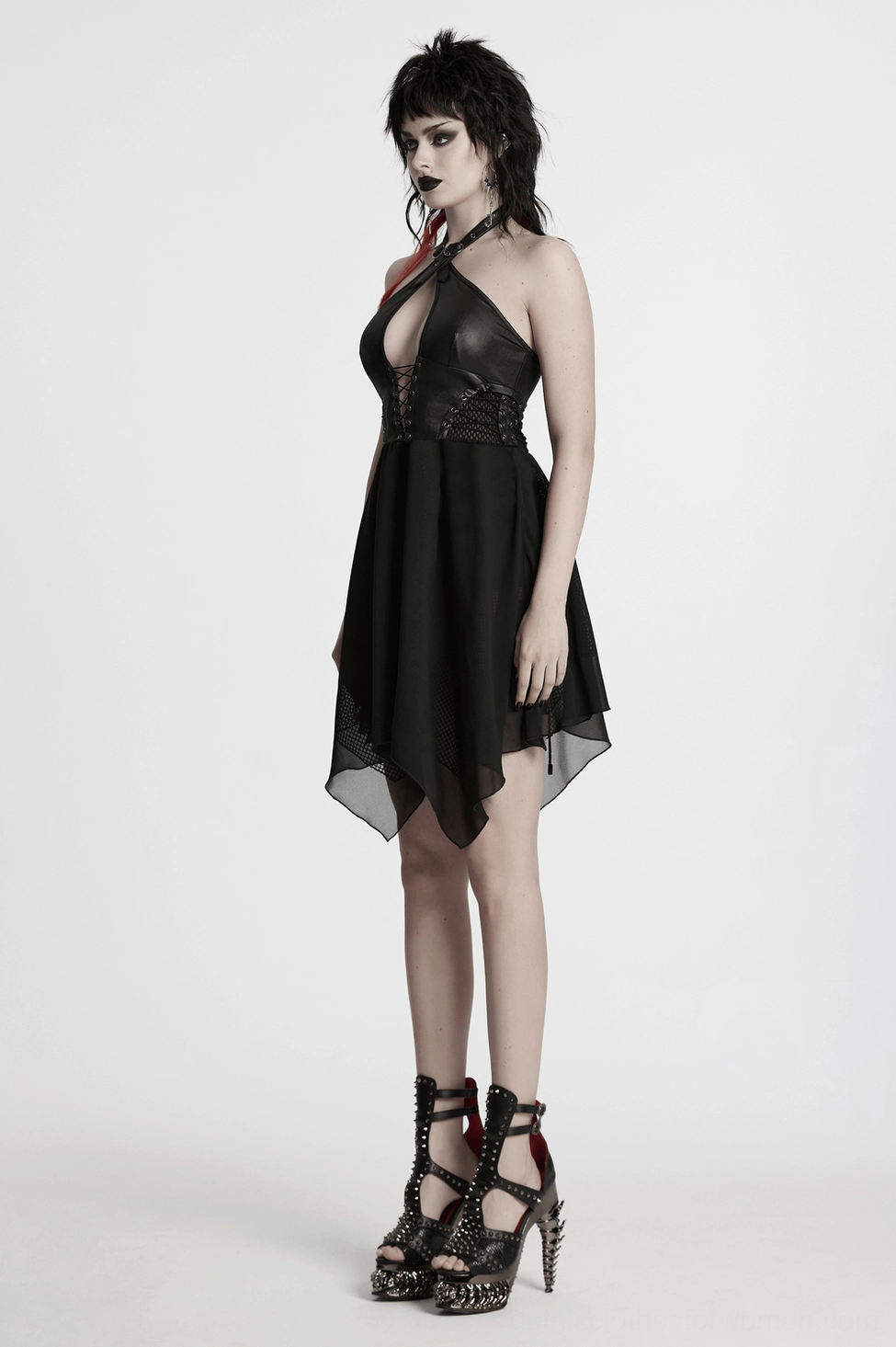 Black gothic dress detail photo highlighting lace-up back corset design and chiffon hem layers aesthetic