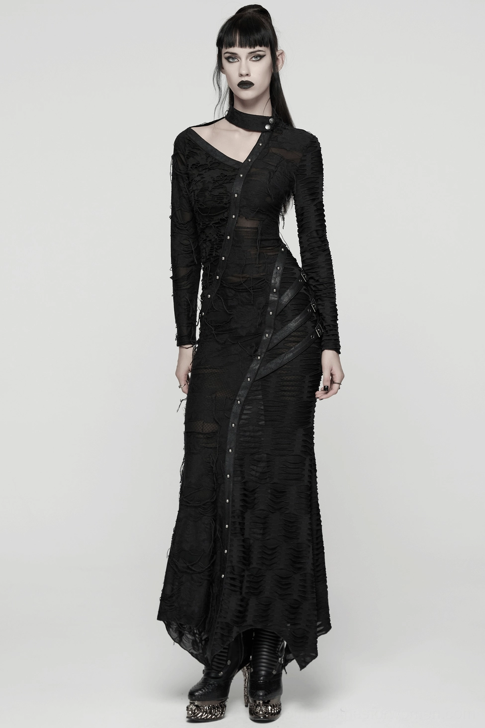 Black gothic dress showing asymmetric layered design with rivets and textured fabric details