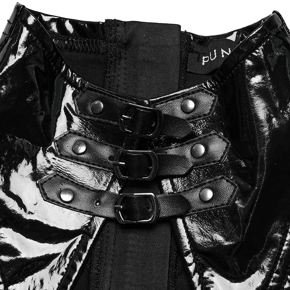 Close-up detail of metal buckle hardware on black gothic dress showing triple silver buckles and glossy vinyl texture