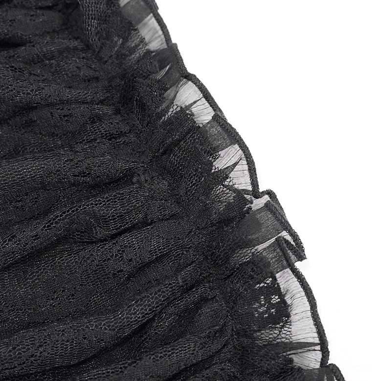 Close-up detail of black gothic dress ruffled mesh trim and layered lace