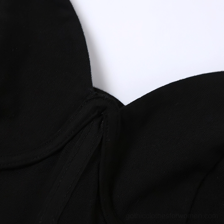 Black gothic dress stitching and seam detail, showcasing quality construction and matte black stretch fabric