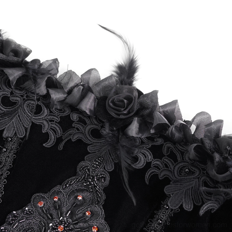 Black gothic evening dress detail shot - lace layering and embellishment showing intricate gothic fashion design