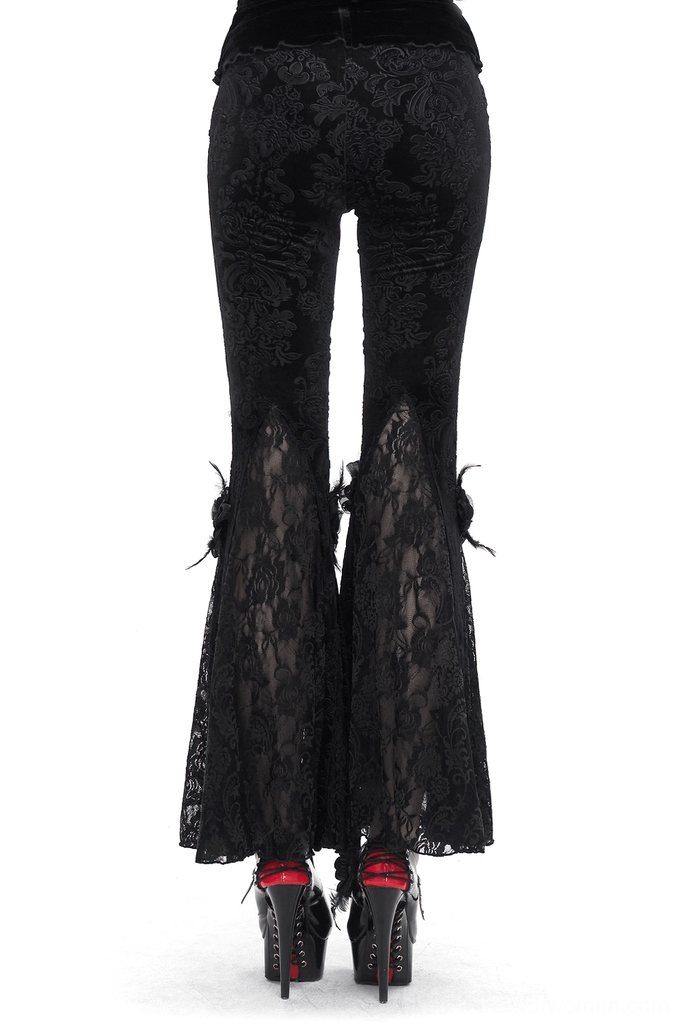 Black damask lace gothic flared pants back view showing sheer lace legs, model wearing platform heels on white background