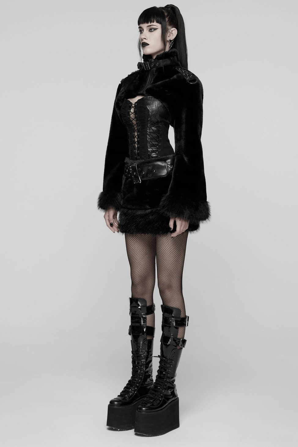 Black faux fur gothic mini skirt with studded leather belt worn by model showing how the piece moves and drapes when styled