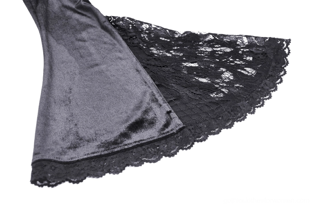 Close-up detail of voluminous black puff sleeve with lace flare trim and scalloped edge on Victorian gothic gown
