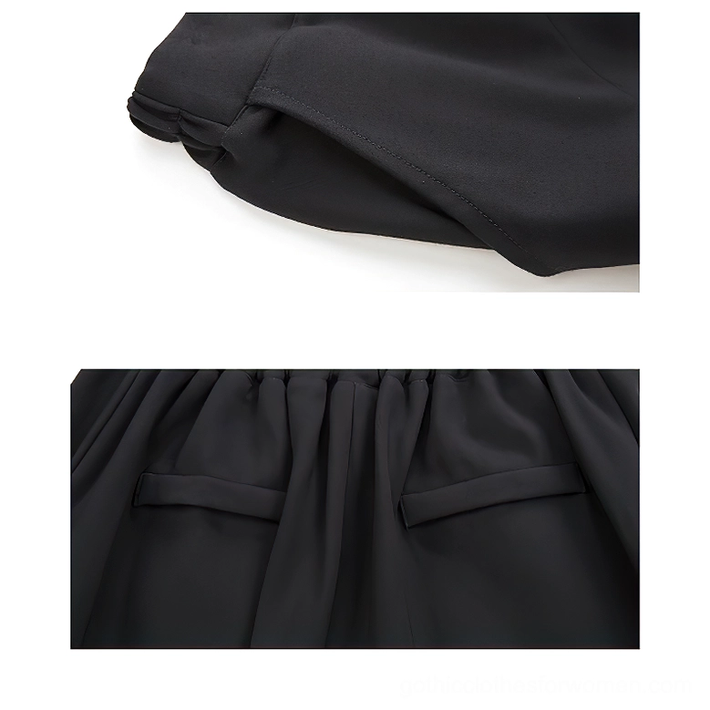 Close-up texture detail of smooth matte black broadcloth fabric with neat stitched edge on gothic harem pants