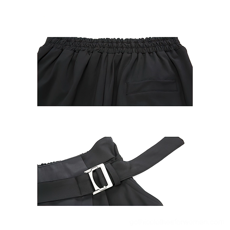 Black gothic harem pants flat lay front view displaying dual-tone asymmetrical paneling, dual side cargo pockets, and D-ring metal belt buckle