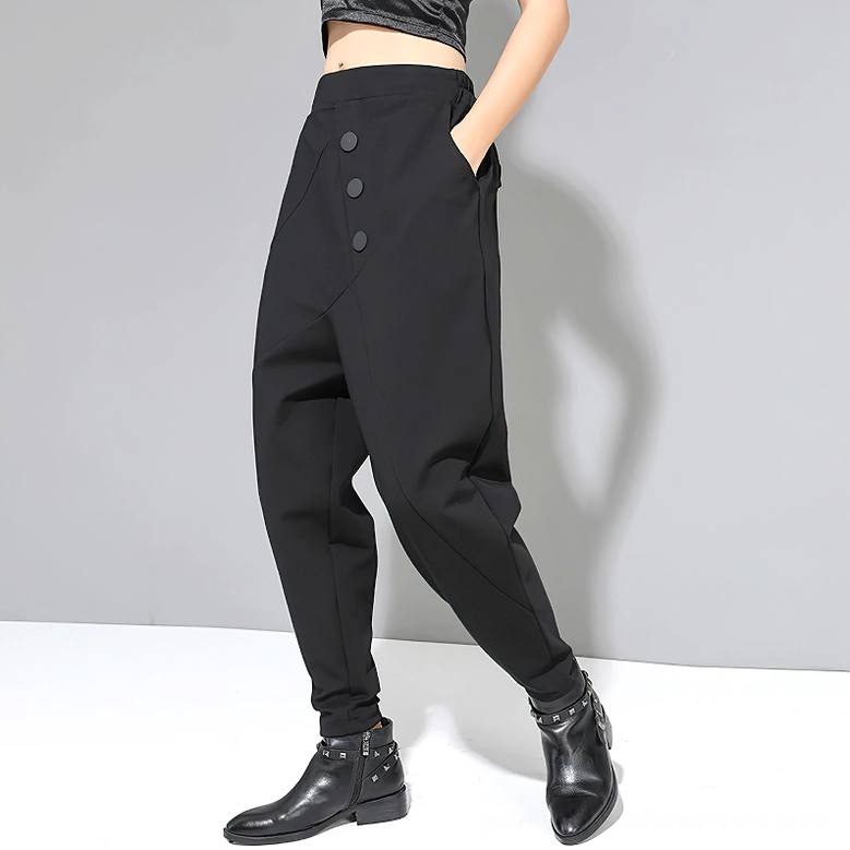 Black gothic harem trousers side view featuring drop crotch design and side pocket detail
