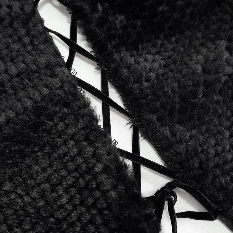 Black gothic hooded short cape with feather and pom-pom embellishments styled detail shot