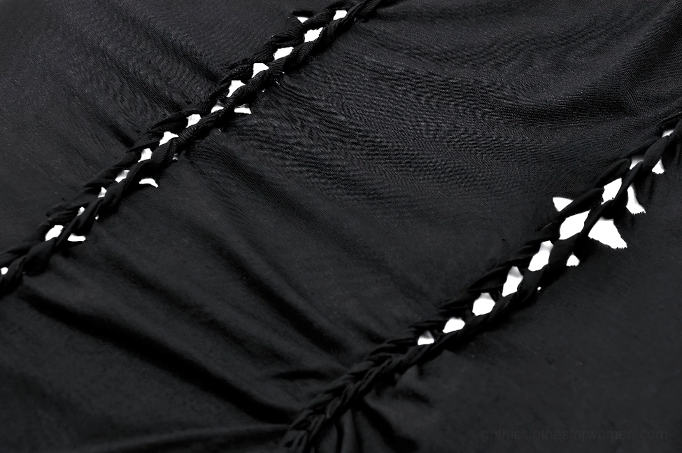 Cutout lace-up braided detail of gothic top - textured knit fabric with intricate stitching and design pattern