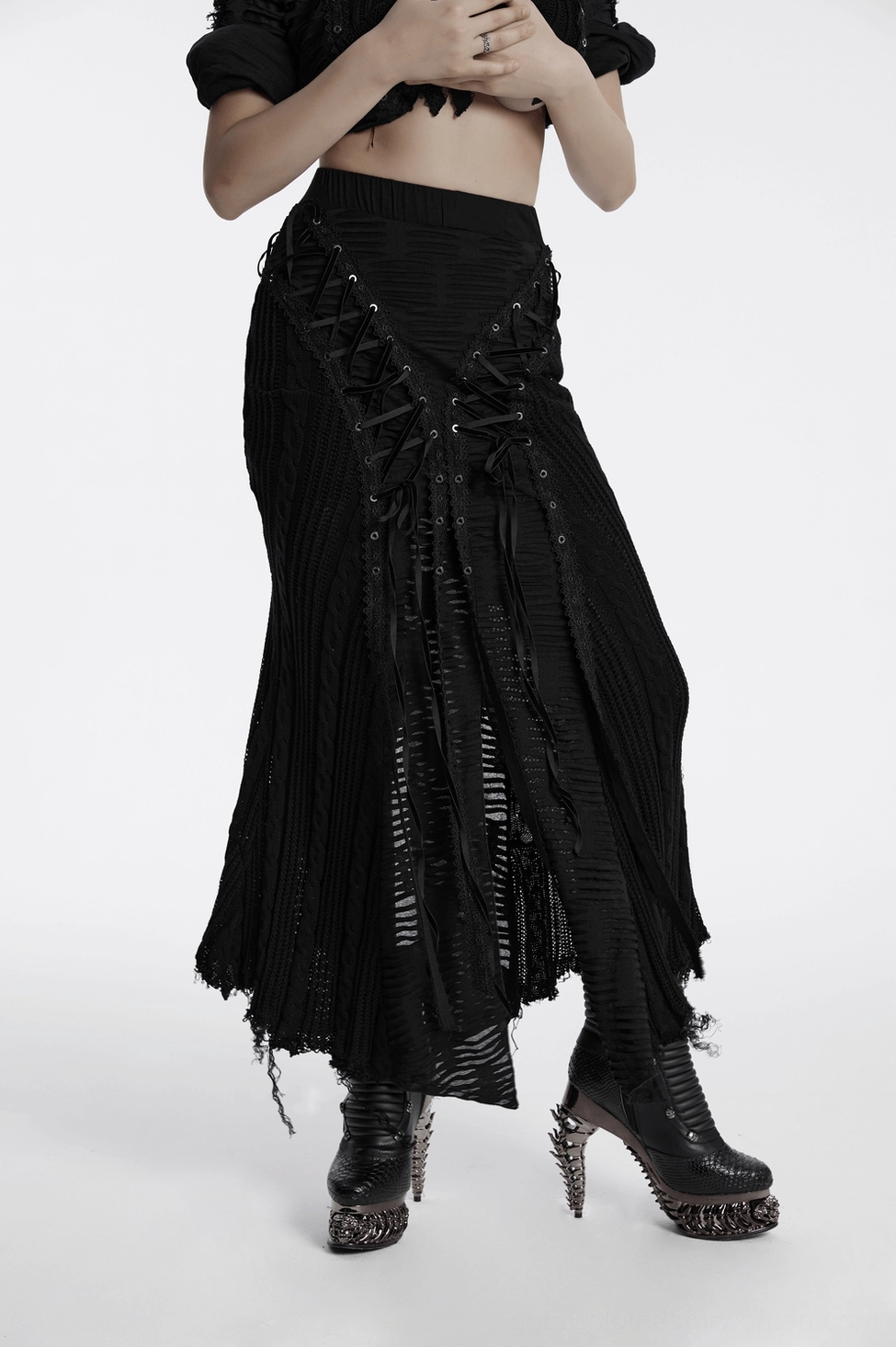 Black gothic distressed knit maxi skirt displaying lace-up details and frayed asymmetric hemline